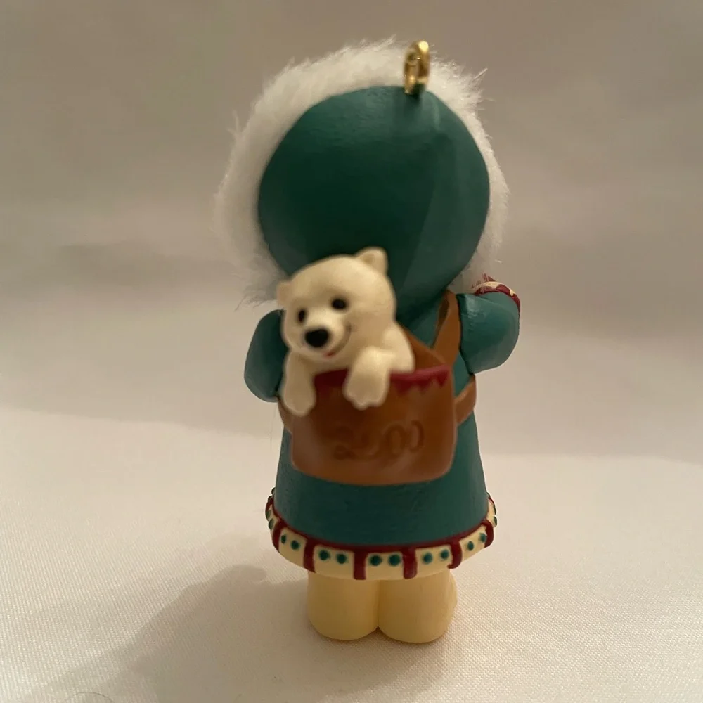 Hallmark Ornament - Girl in Teal and White with Red Accents. EUC in original box